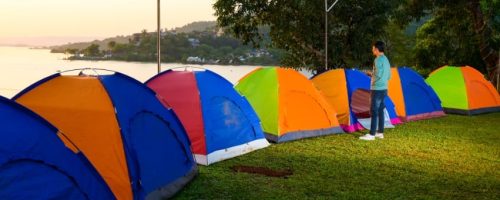 Pawna Lake campsite tents with lake view during sunset