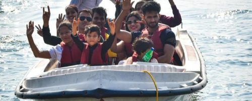Boating activity at Pawna Lake campsite with group adventure